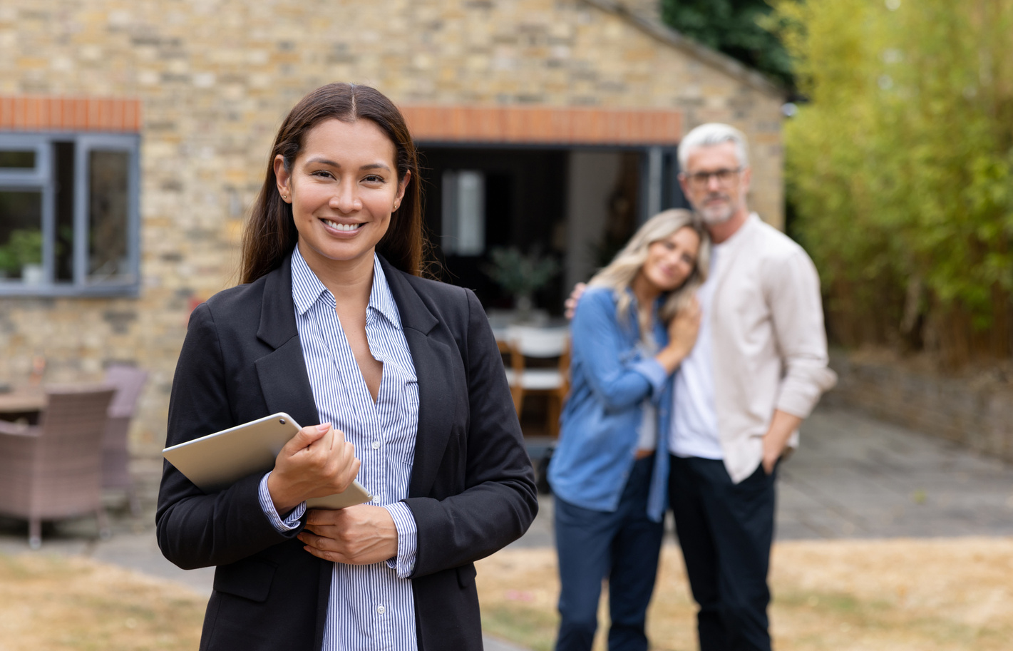 Real estate agent showing a house to a couple